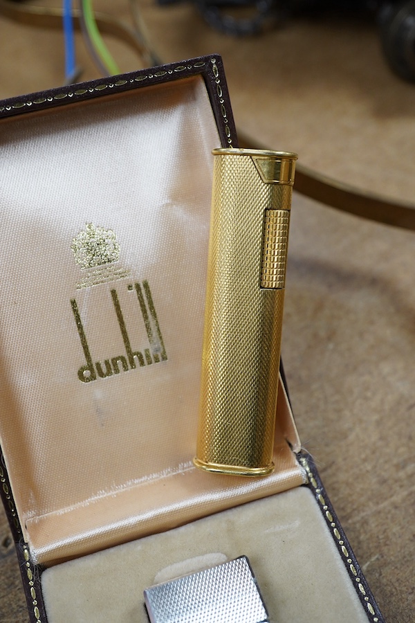 Two Dunhill Rollalite lighters, gold plated and silver, gold plated 7 cm high, Condition - fair to good